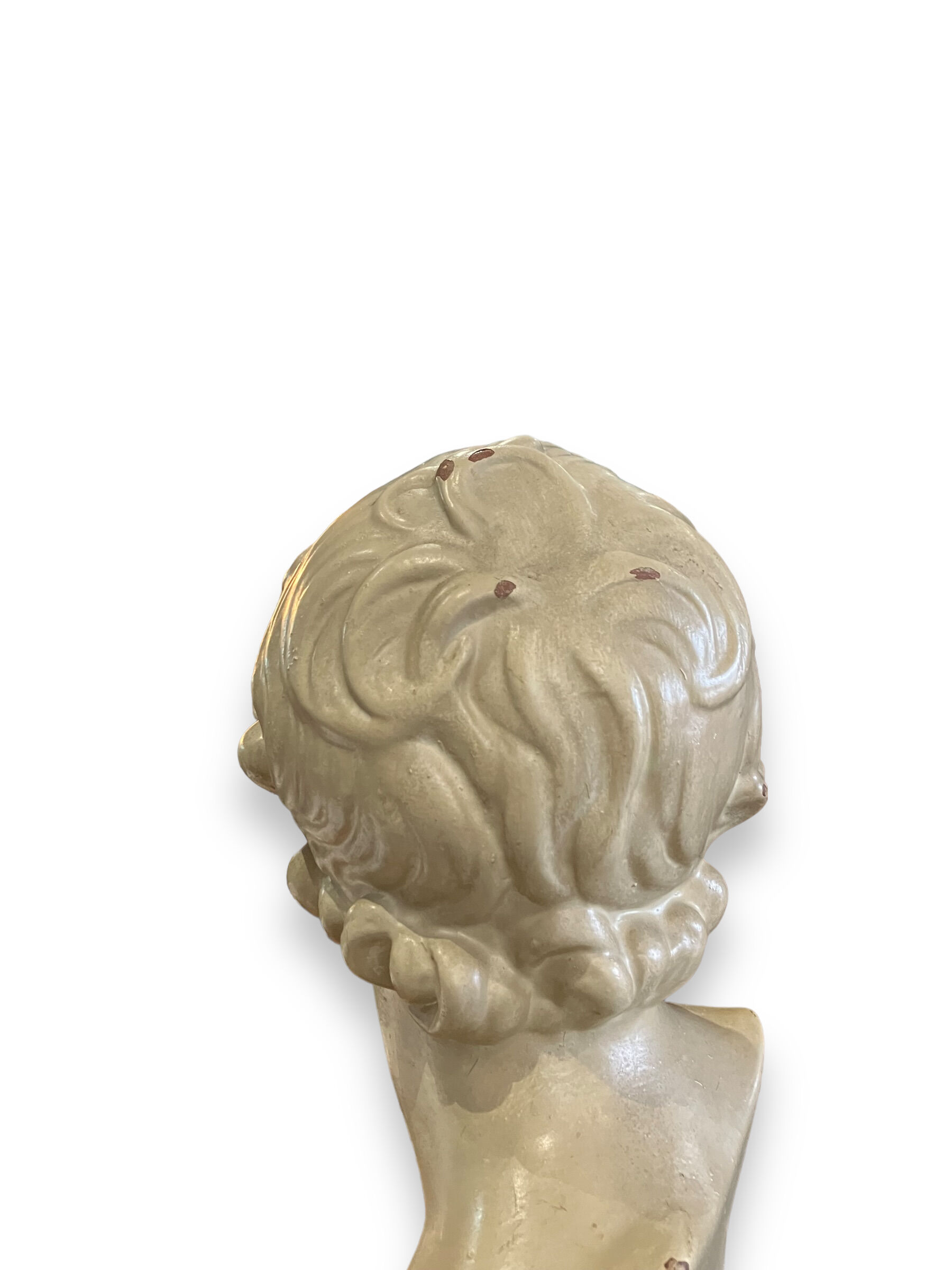 Bust of eros in glazed terracotta