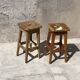 Pair of vintage wooden workshop stools with a patina.