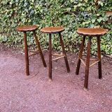 Set of three brutalist tripod stools