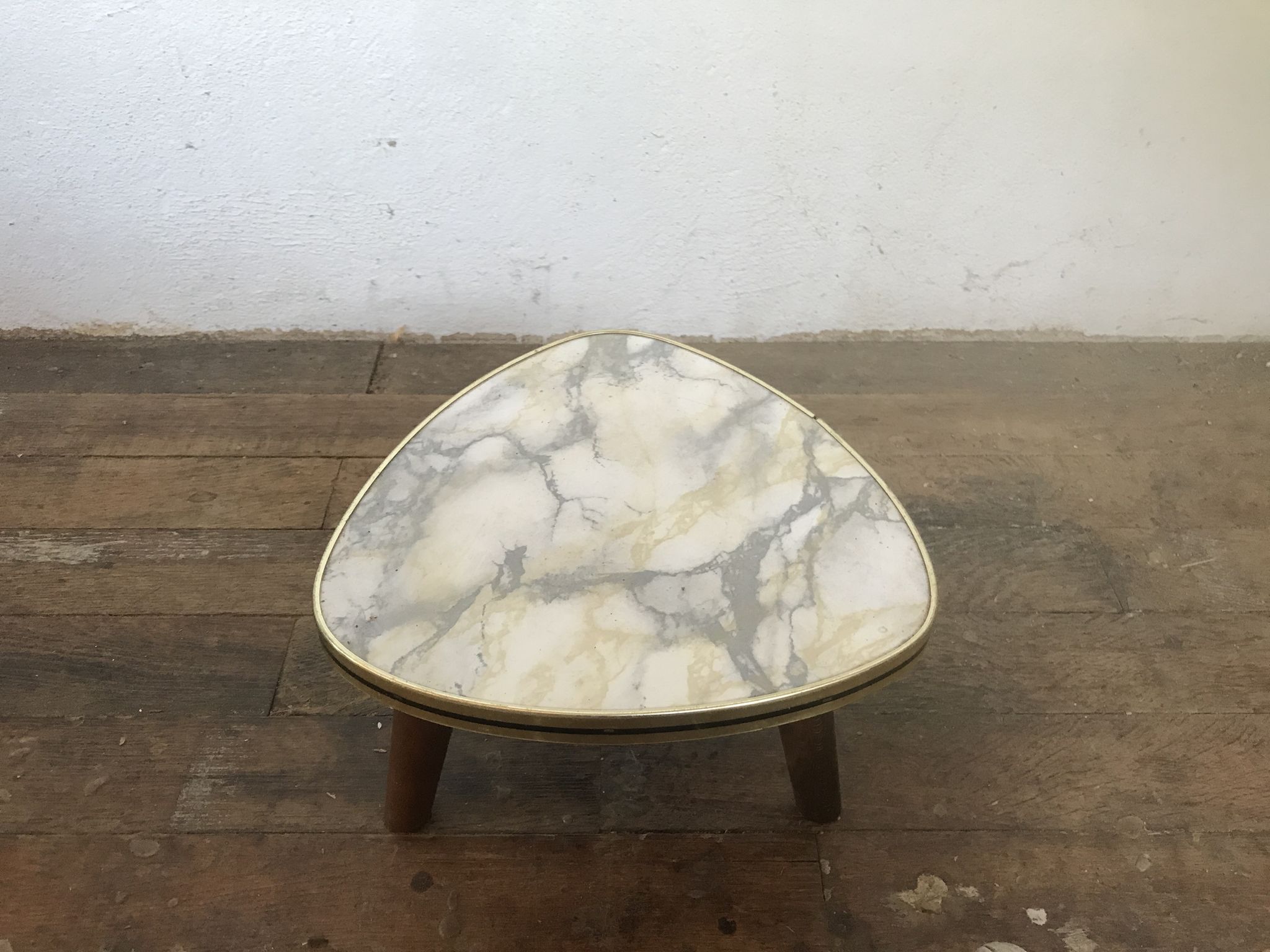 Small triangular table coffee table with a vintage tripod door midcentury plant 1950