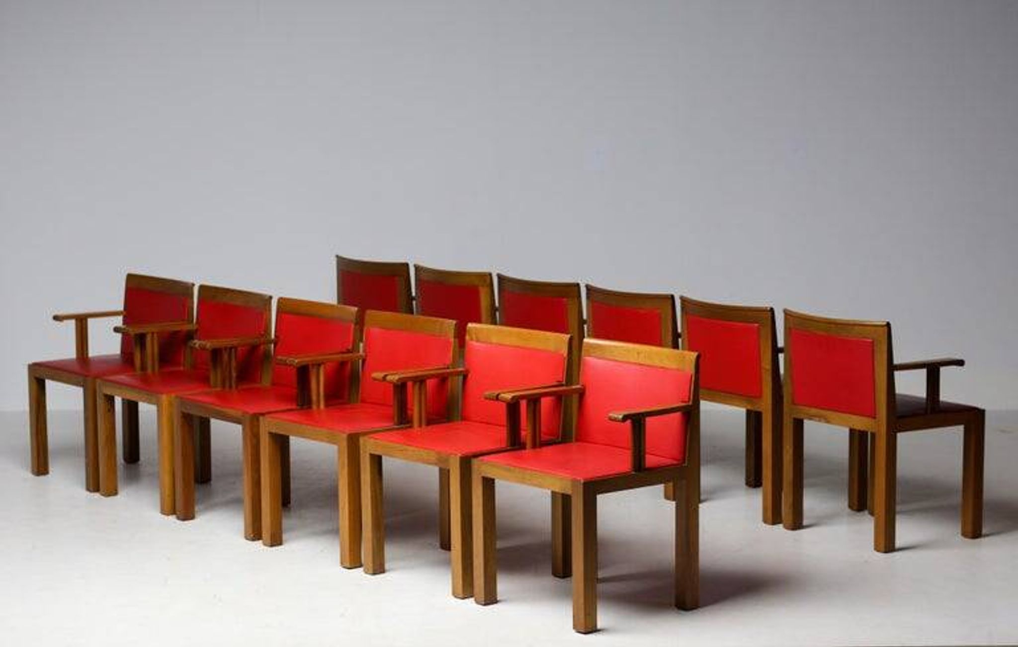A masterpiece of Italian modernism: eleven Aldo Rossi red Teatro arm chairs