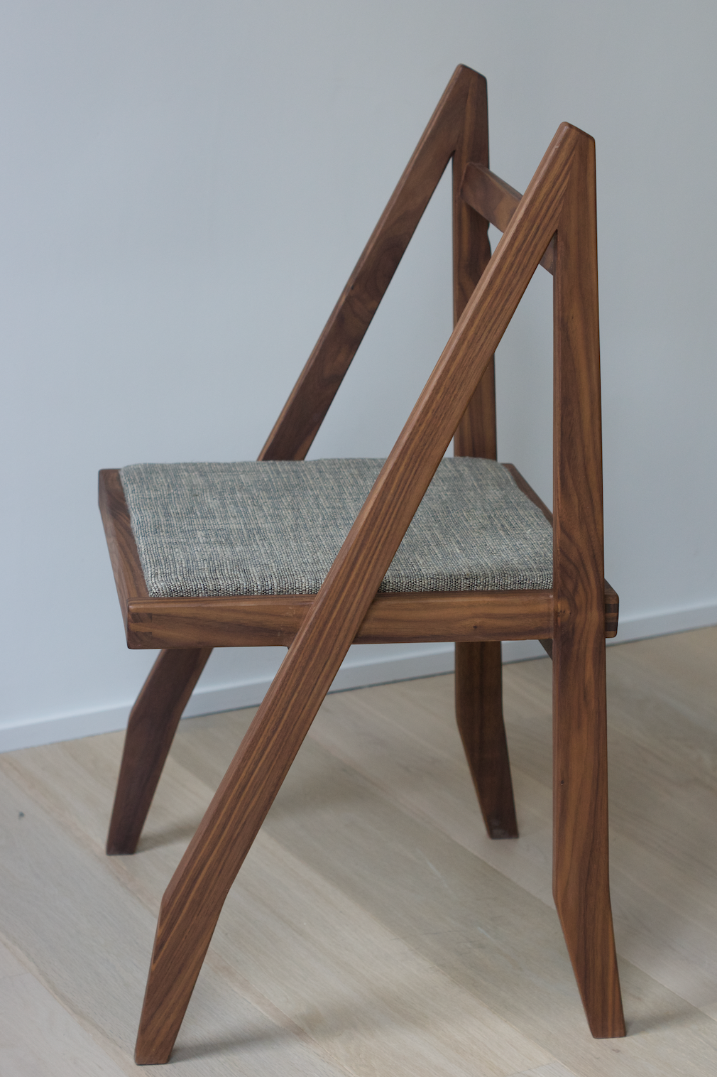 Walnut chair designed by Martin Gillis Studio