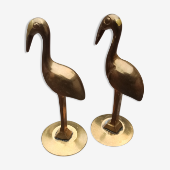 Two ancient brass flamingos
