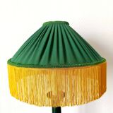 Green ceramic lamp with a vintage pleated fringe shade.