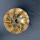 Brass candlestick in a fluted shape from the early 20th century.