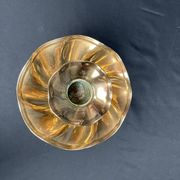 Brass candlestick in a fluted shape from the early 20th century.
