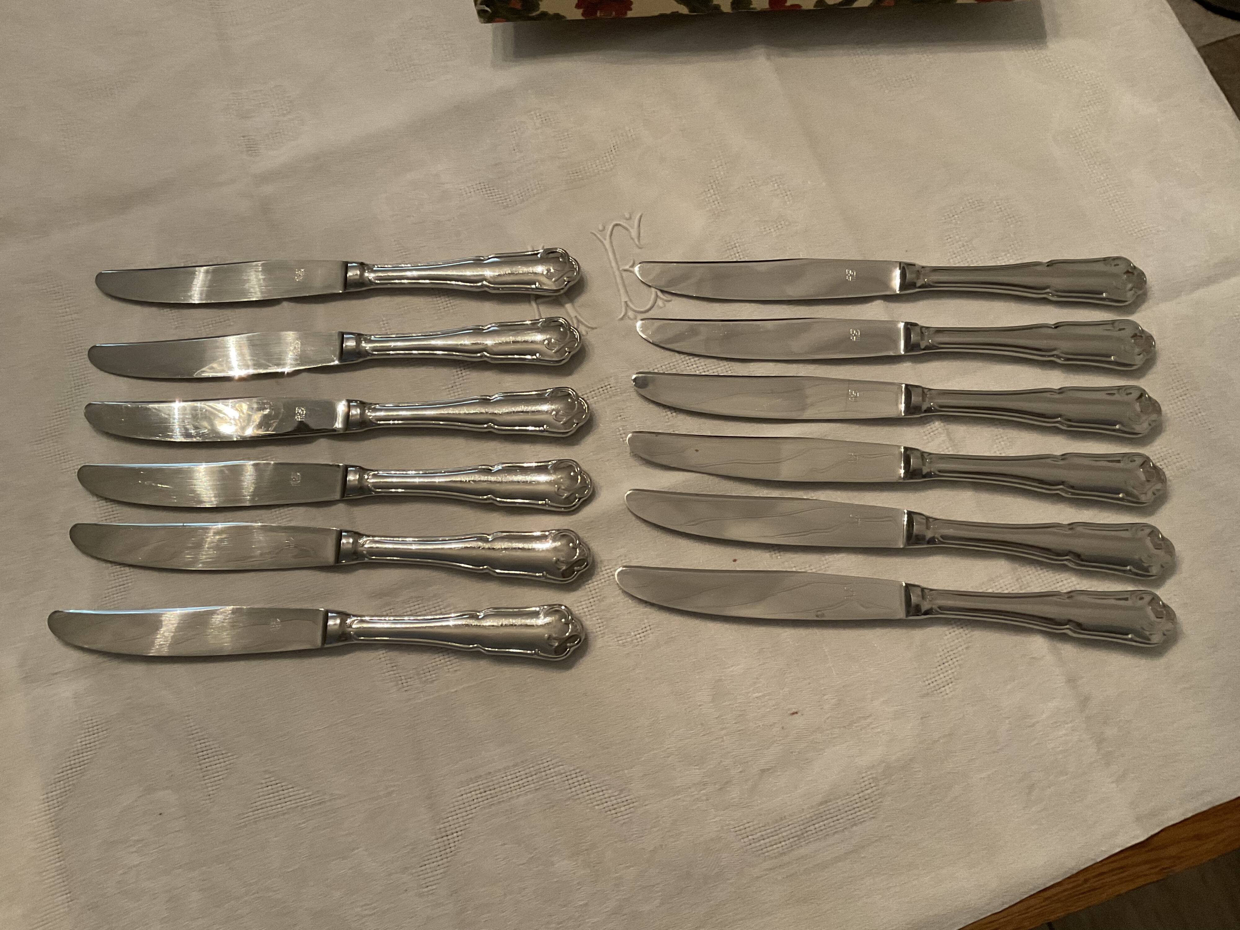 12 stainless steel knives. vintage