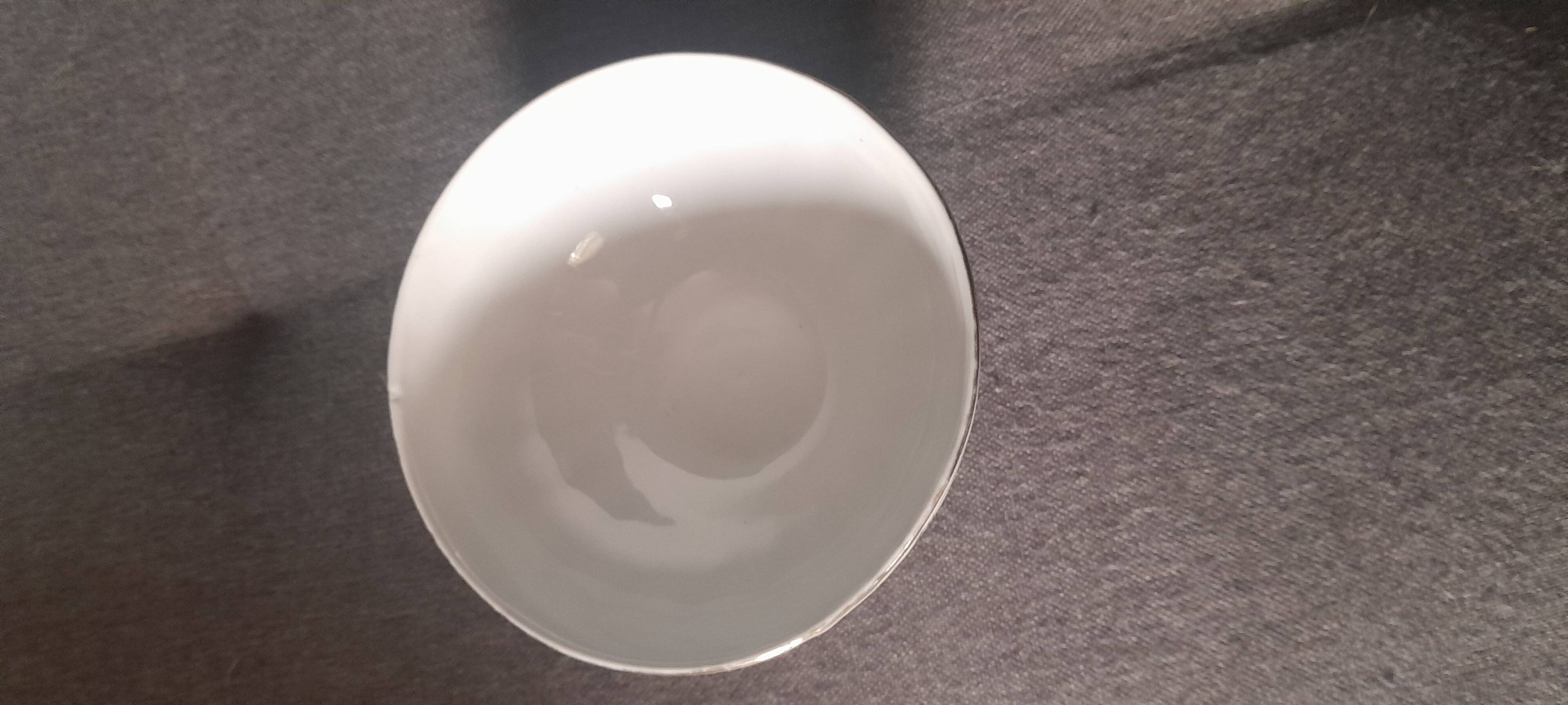 White earthenware bowl with decorative flowers