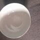White earthenware bowl with decorative flowers