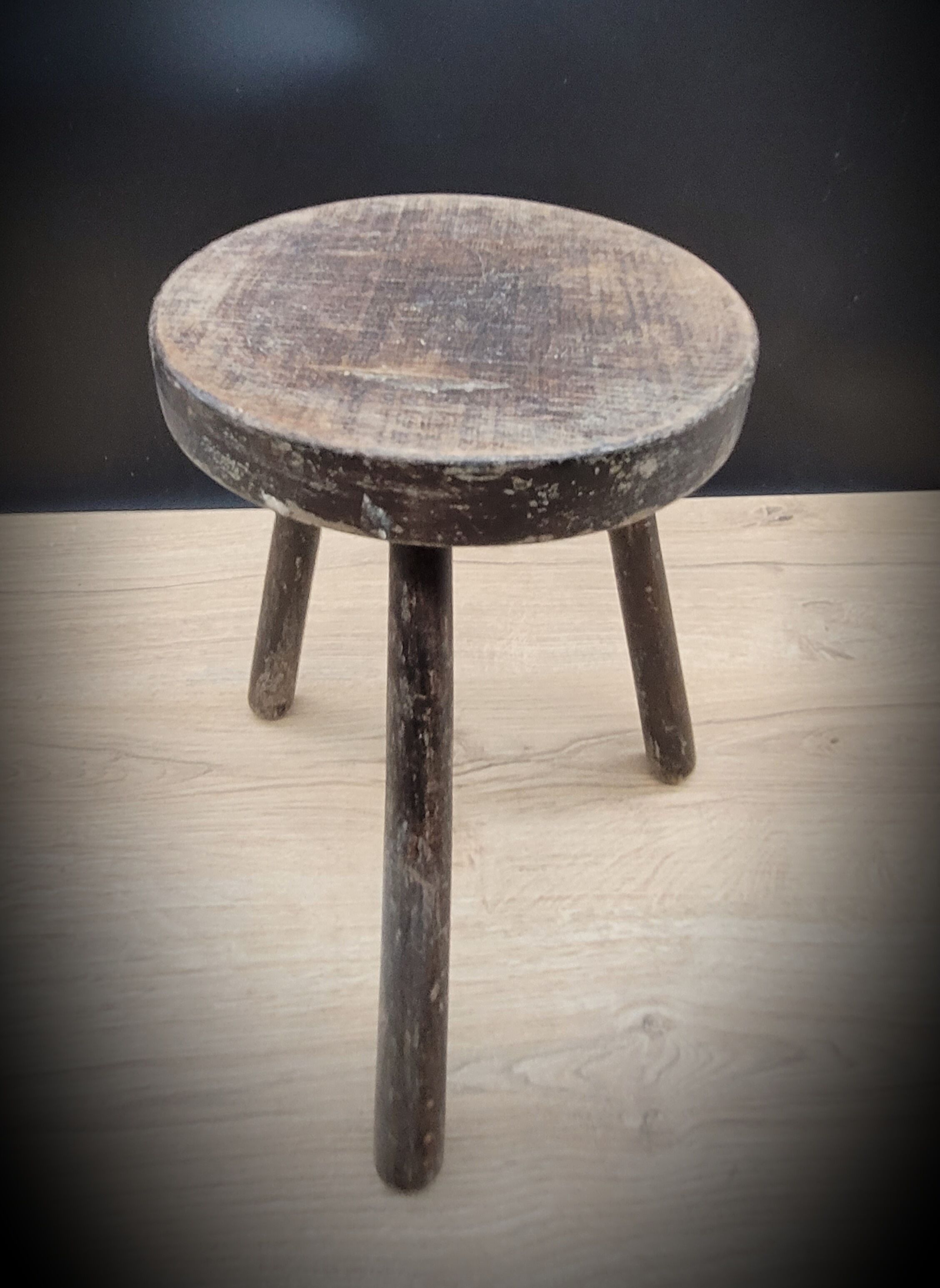 Massive black tripod stool