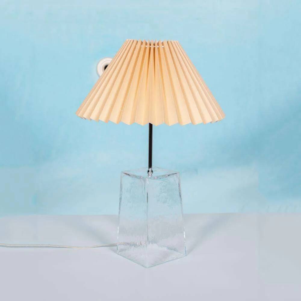 Minimalist glass table lamp from the 80s with a pleated shade.