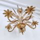 Vintage wrought iron chandelier decorated with golden and beige reeds