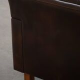 Pair of modern Danish lounge chairs in dark brown leather and rosewood, 1960s.