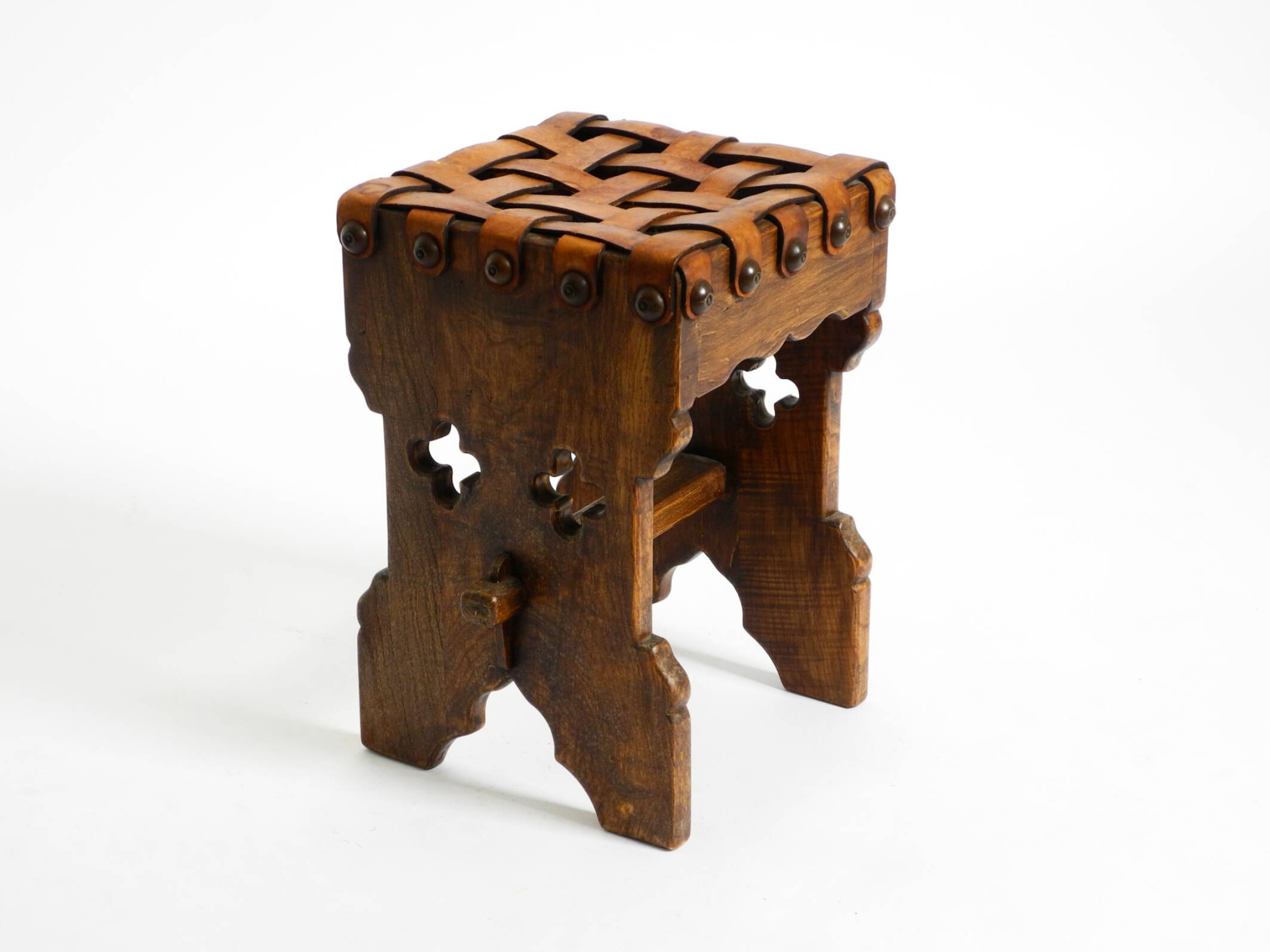 Beautiful 1940s oak stool with a seat made of leather straps