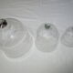 trio of old bells in transparent glass