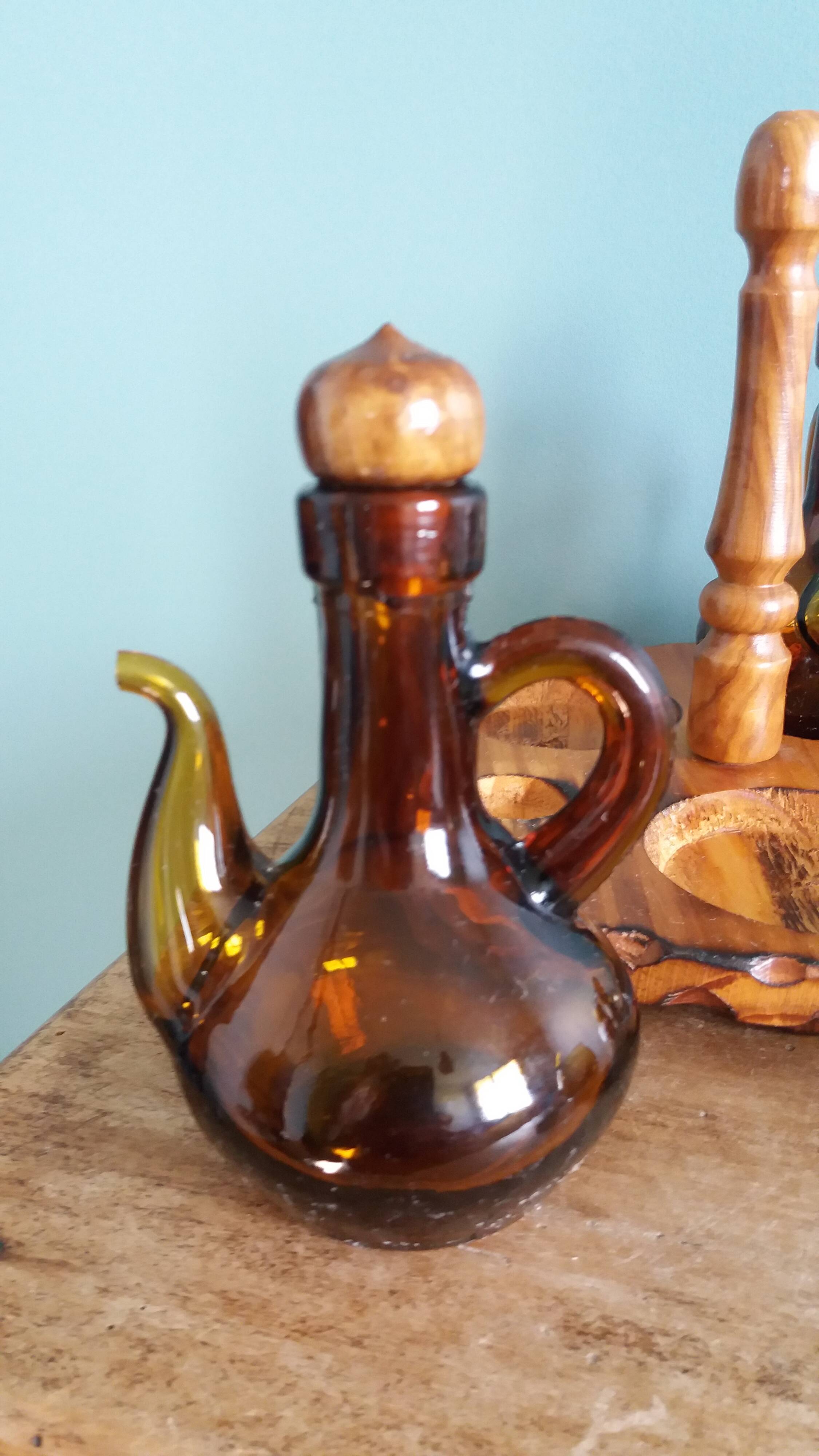 Oil, vinegar, mustard, pepper, salt, olive wood servant from Spain.
