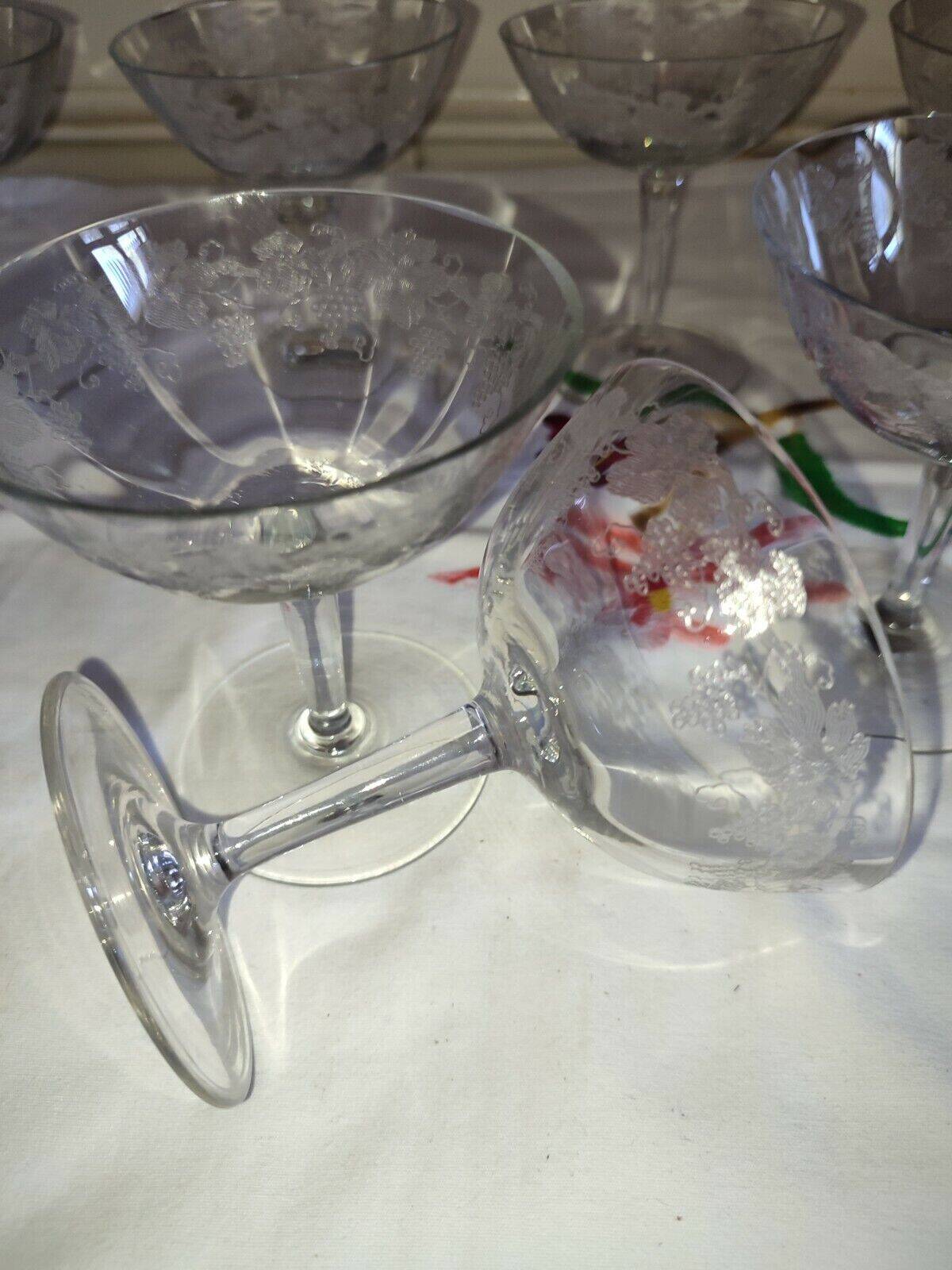 Beautiful set of seven crystal champagne glasses engraved with vine branches