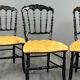 Set of four Napoleon III chairs in blackened wood, 19th century.