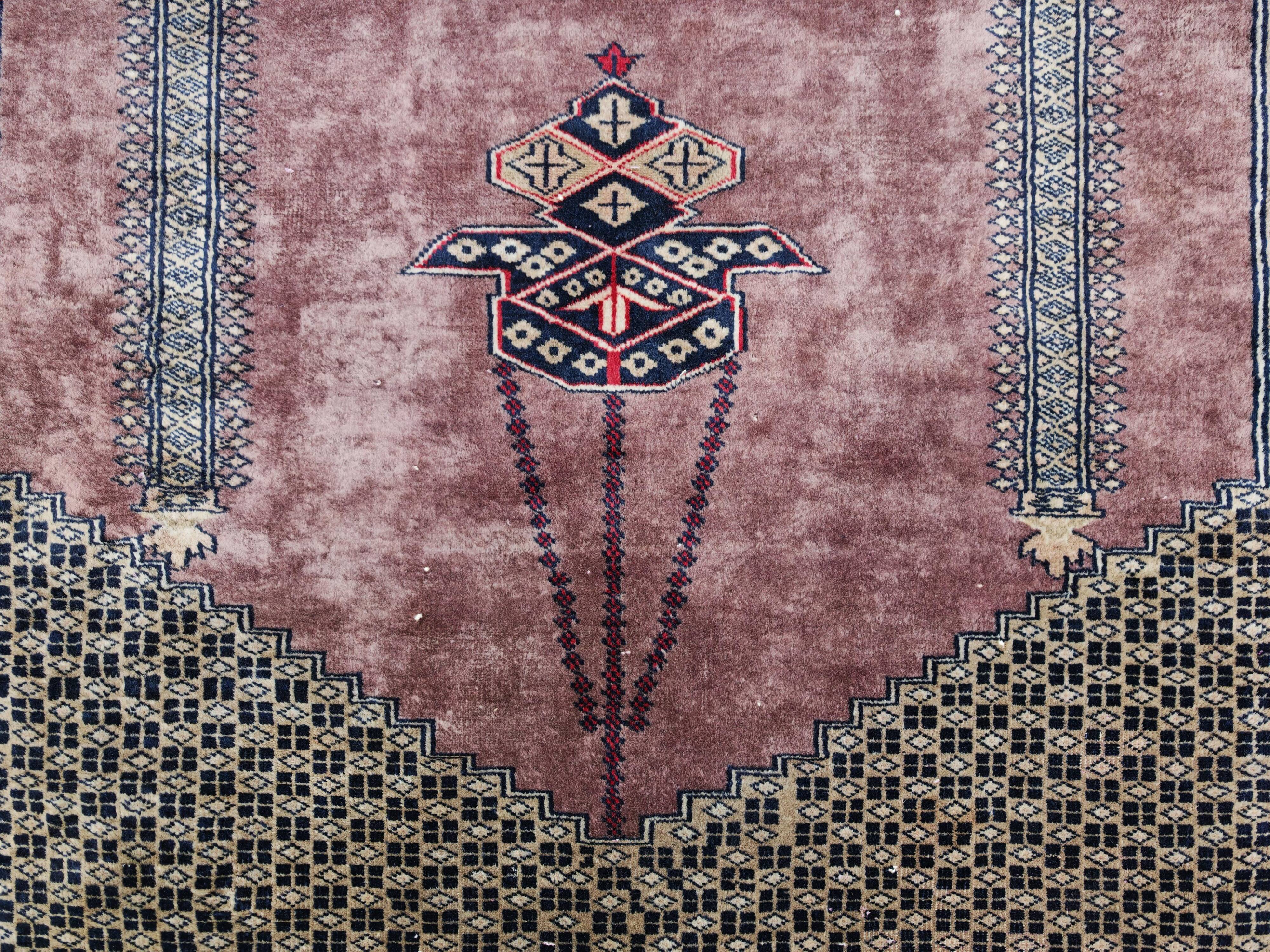 Vintage Anatolian prayer rug made of hand-knotted wool.