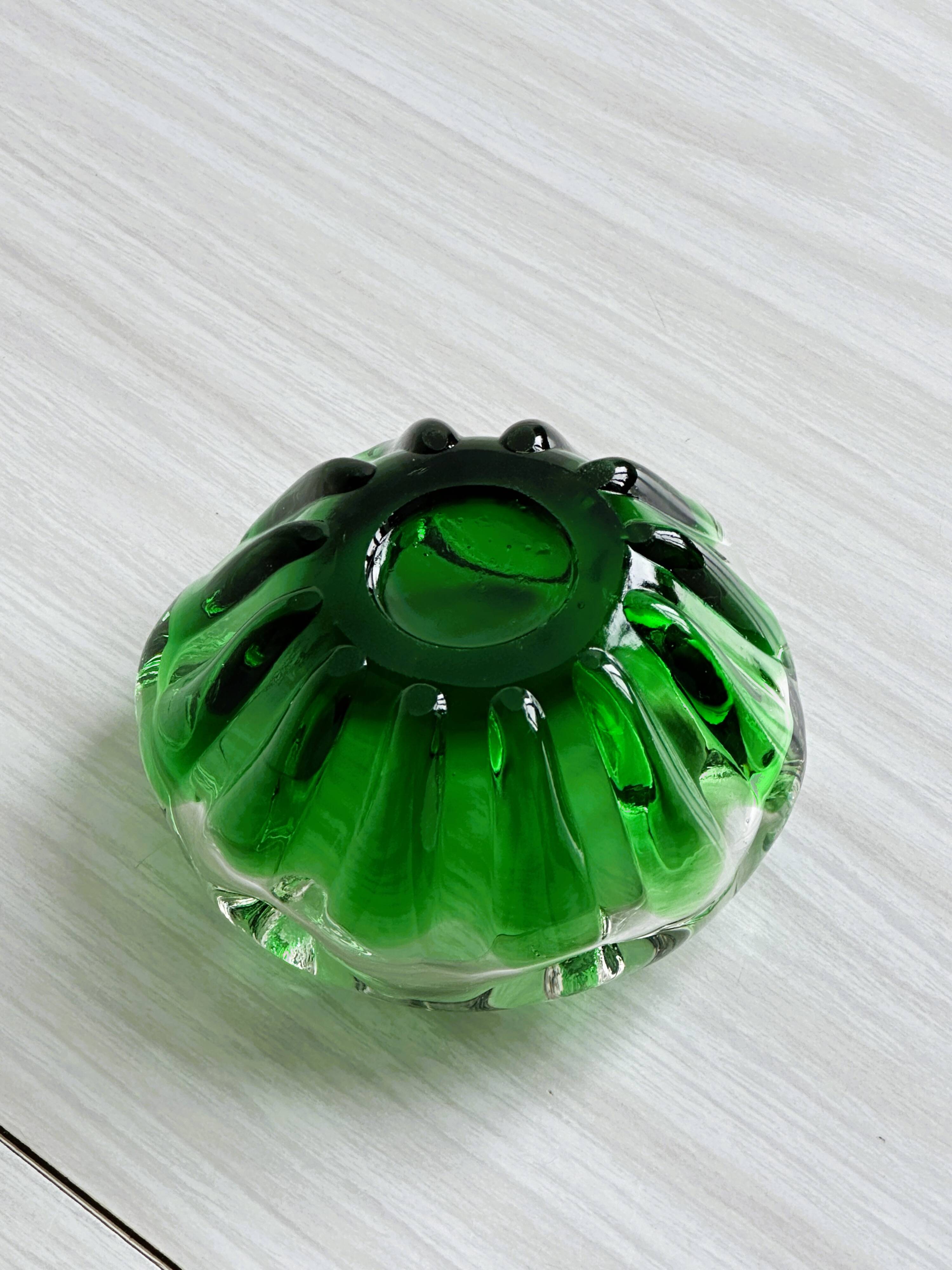 Translucent green ashtray.