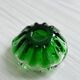 Translucent green ashtray.