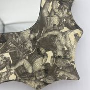 Free-form mirror decorated with cherubs.