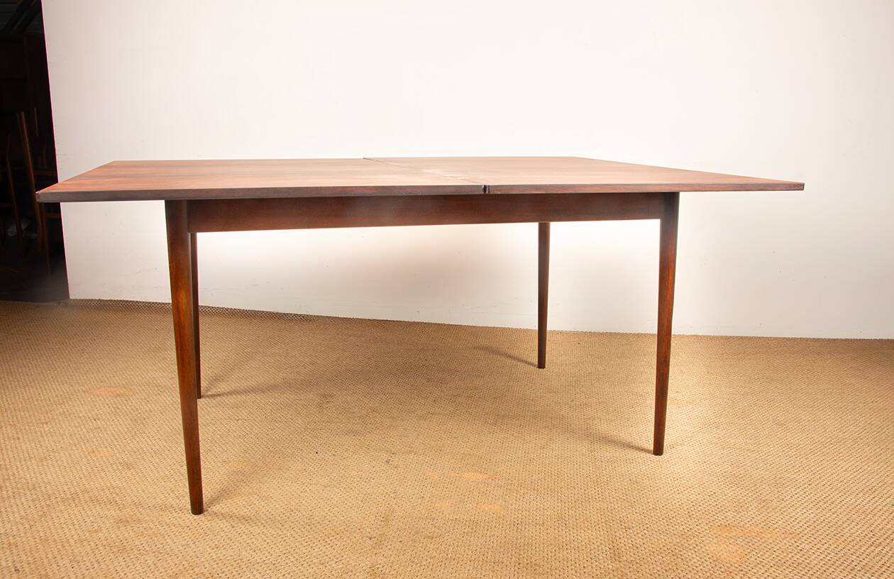Danish extendable dining table in rosewood and brass by Poul Volther