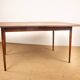 Danish extendable dining table in rosewood and brass by Poul Volther
