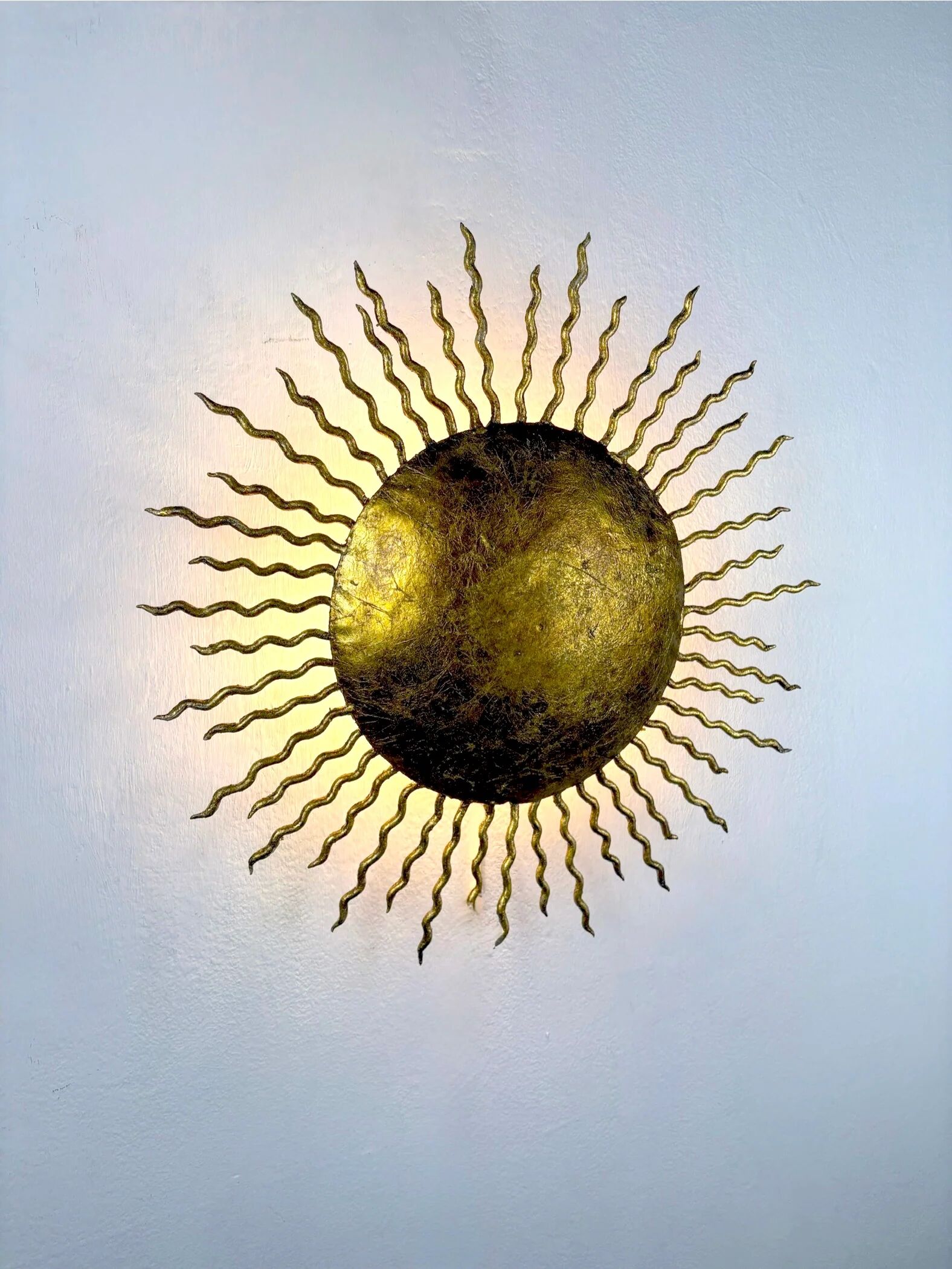 French gilt metal sunburst light fixture, Gilbert Poillerat, 1930s France