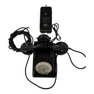 Vintage wall telephone in black Bakelite with transparent dial and case