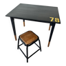 Office table and its low industrial stool.