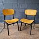 2 vintage chairs in black lacquered wood and yellow/mustard fabric, 1960