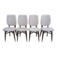 Set of 4 white and wooden Scandinavian chairs.