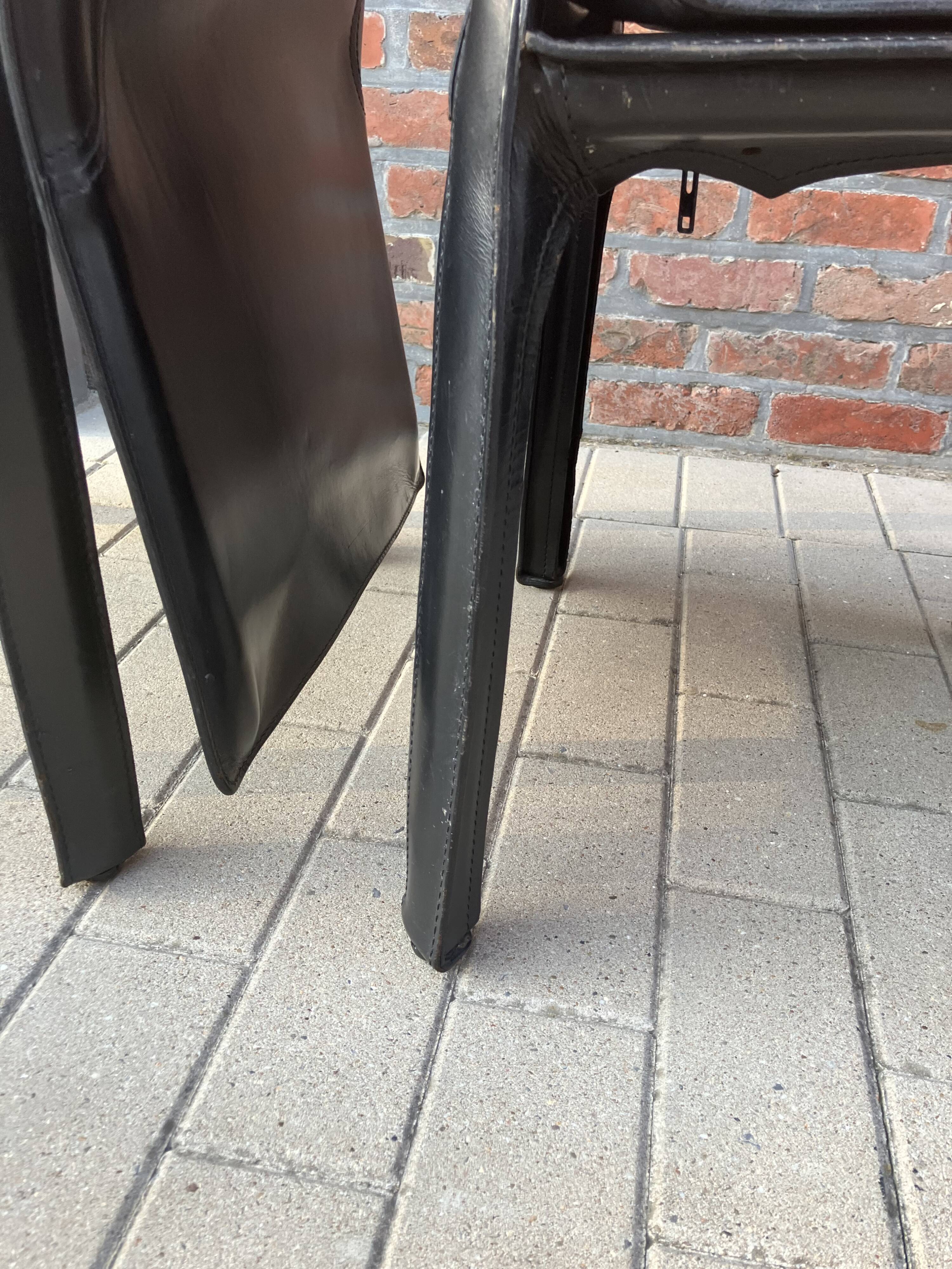 4 black Cassina Cab chairs by Mario Bellini