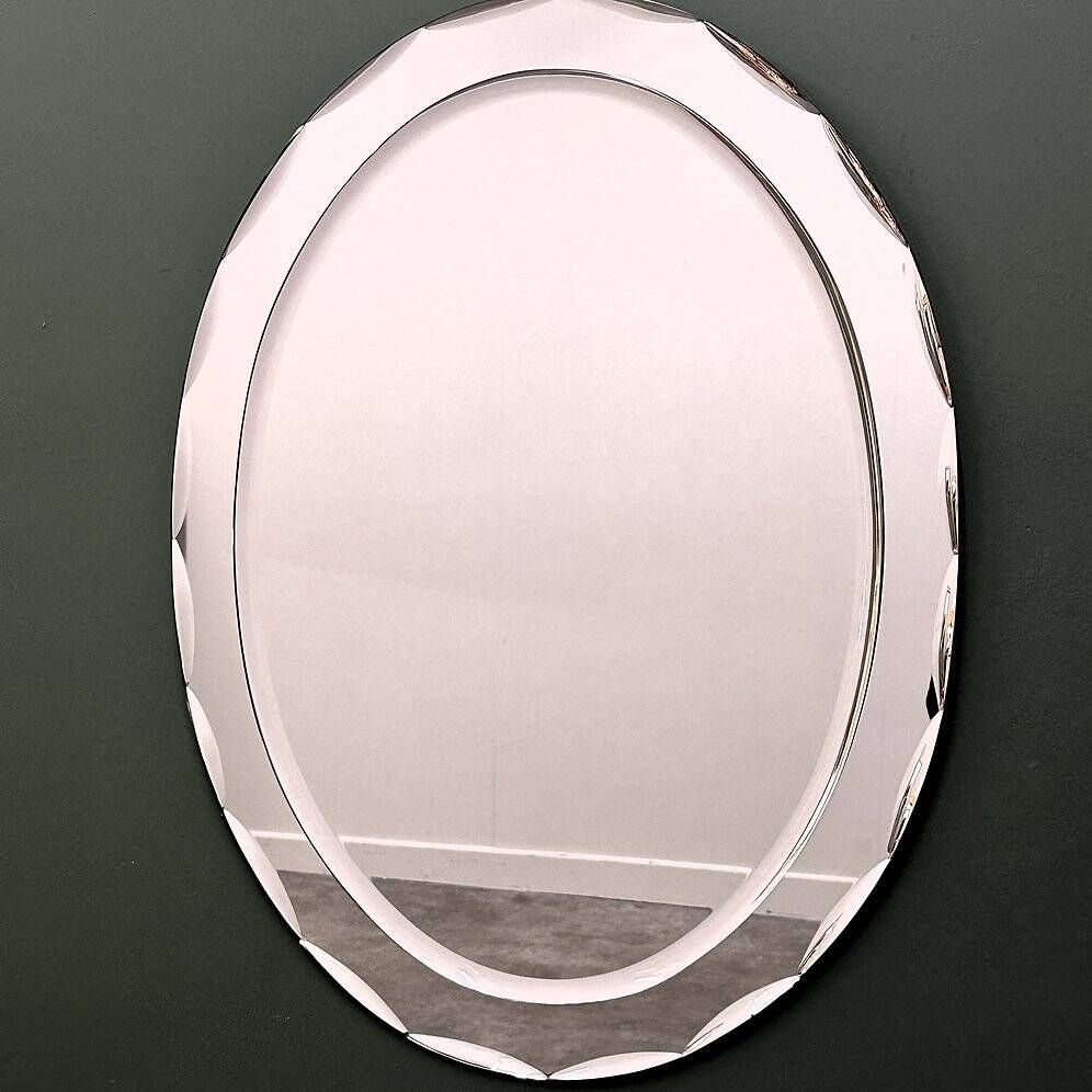 1970s Italian oval mirror by Crystal Arte with faceted glass frame