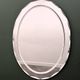 1970s Italian oval mirror by Crystal Arte with faceted glass frame