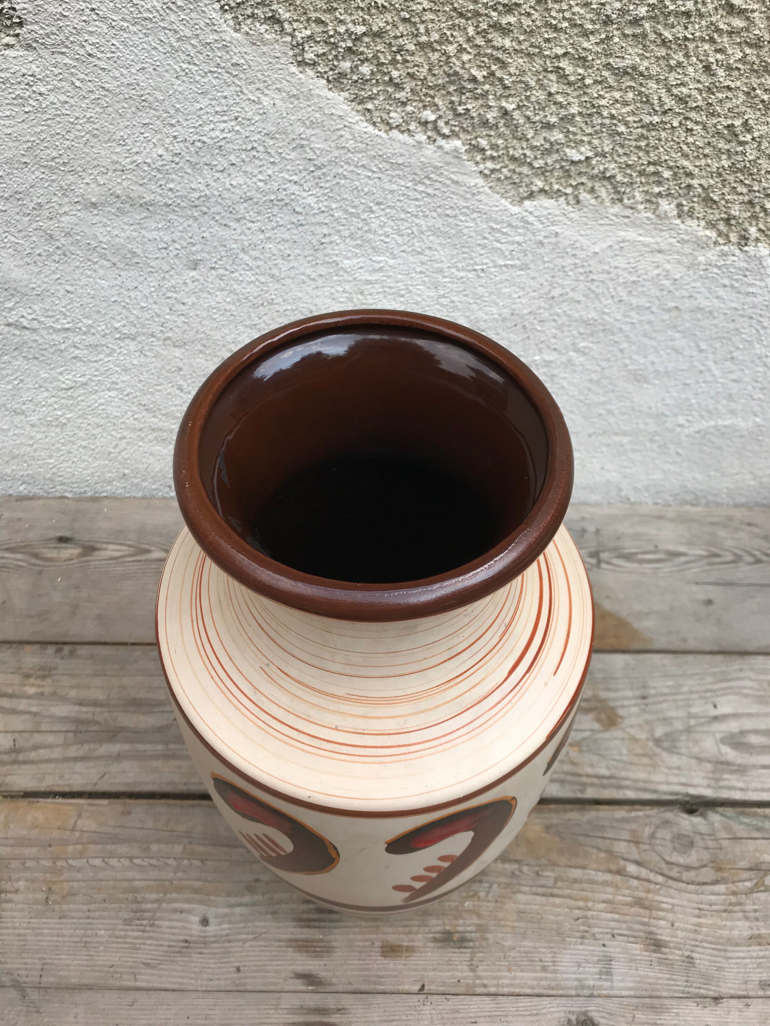 Antique beige ceramic vase with decorative painting