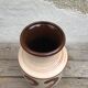 Antique beige ceramic vase with decorative painting