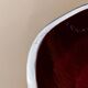 Red enameled steel bowl with textured interior and silver exterior; vintage Italian 1970s design