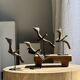 Traditional Indonesian decorative wooden bird on a base, crest model.