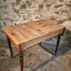 Vintage French pine table with extendable side, circa 1930, suitable for kitchen or office use.