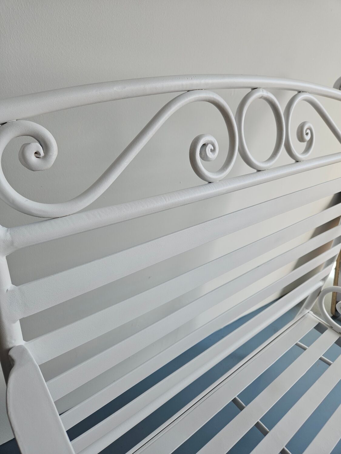Robust wrought iron armchair
