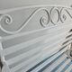 Robust wrought iron armchair