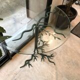 Wrought iron table with tree sculpture and glass top