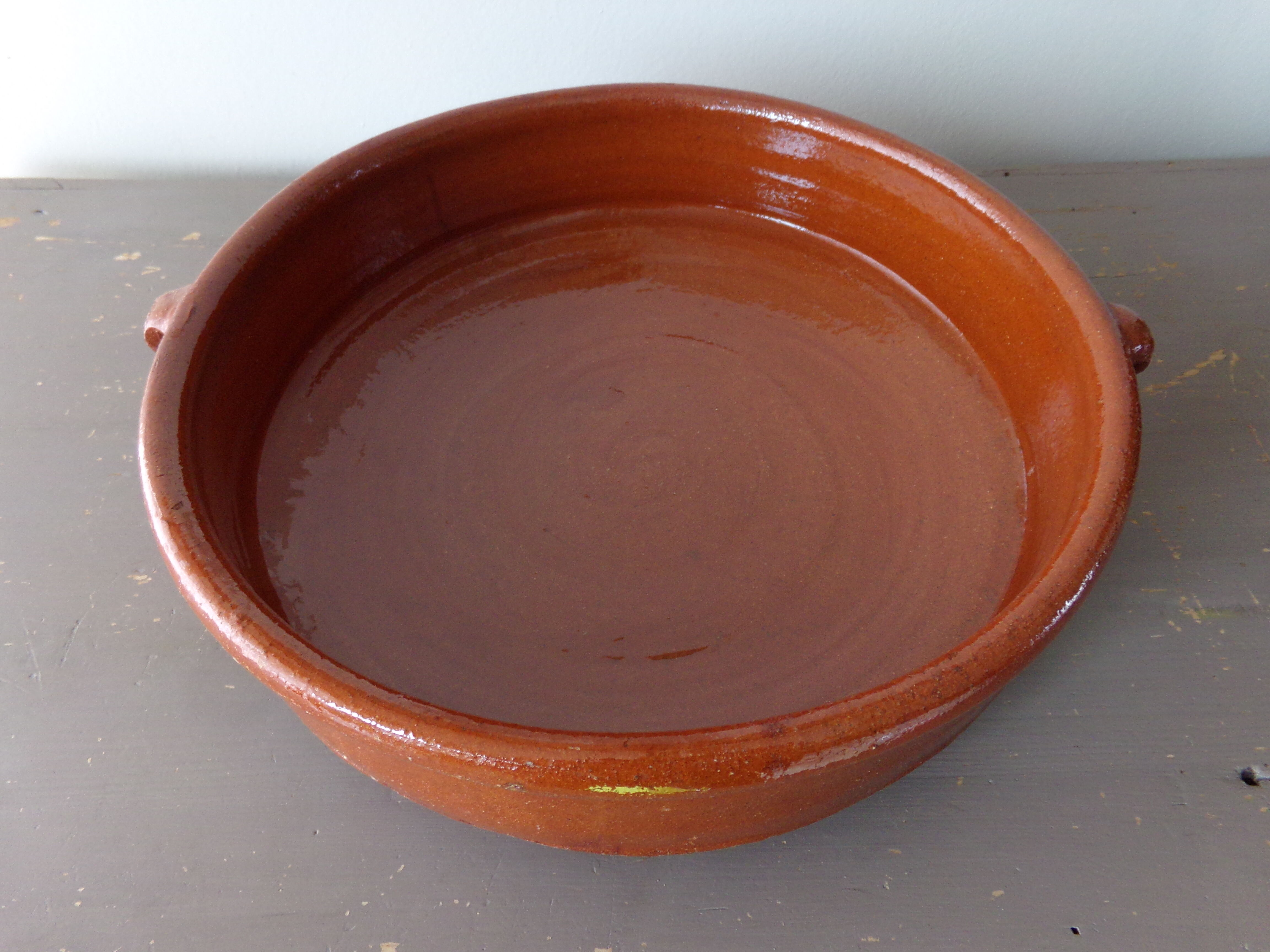 Antique dish in glazed terracotta