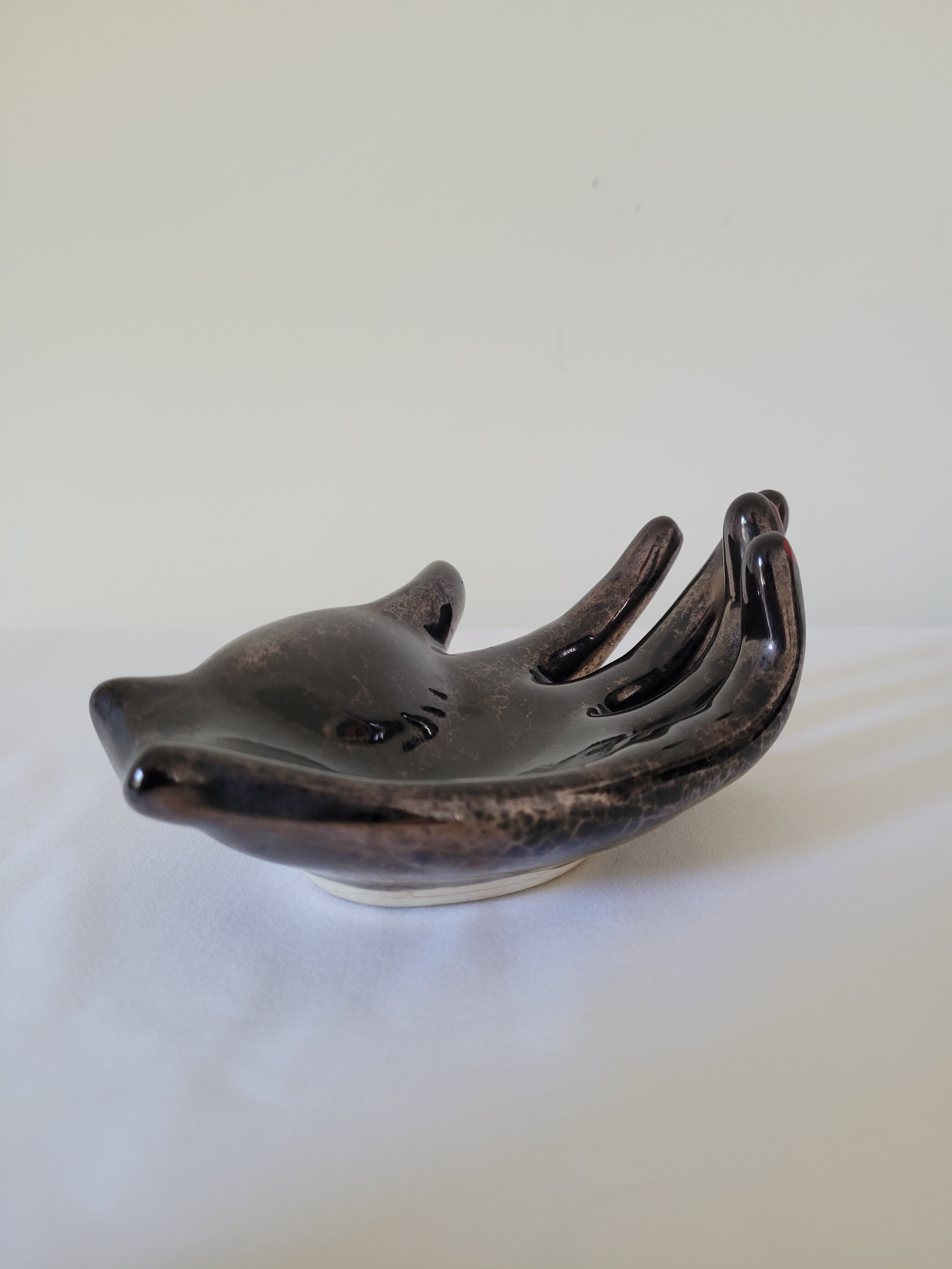 Empty pockets in the shape of a hand