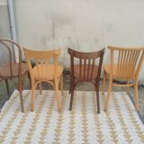 Set of 4 mismatched bistro chairs.