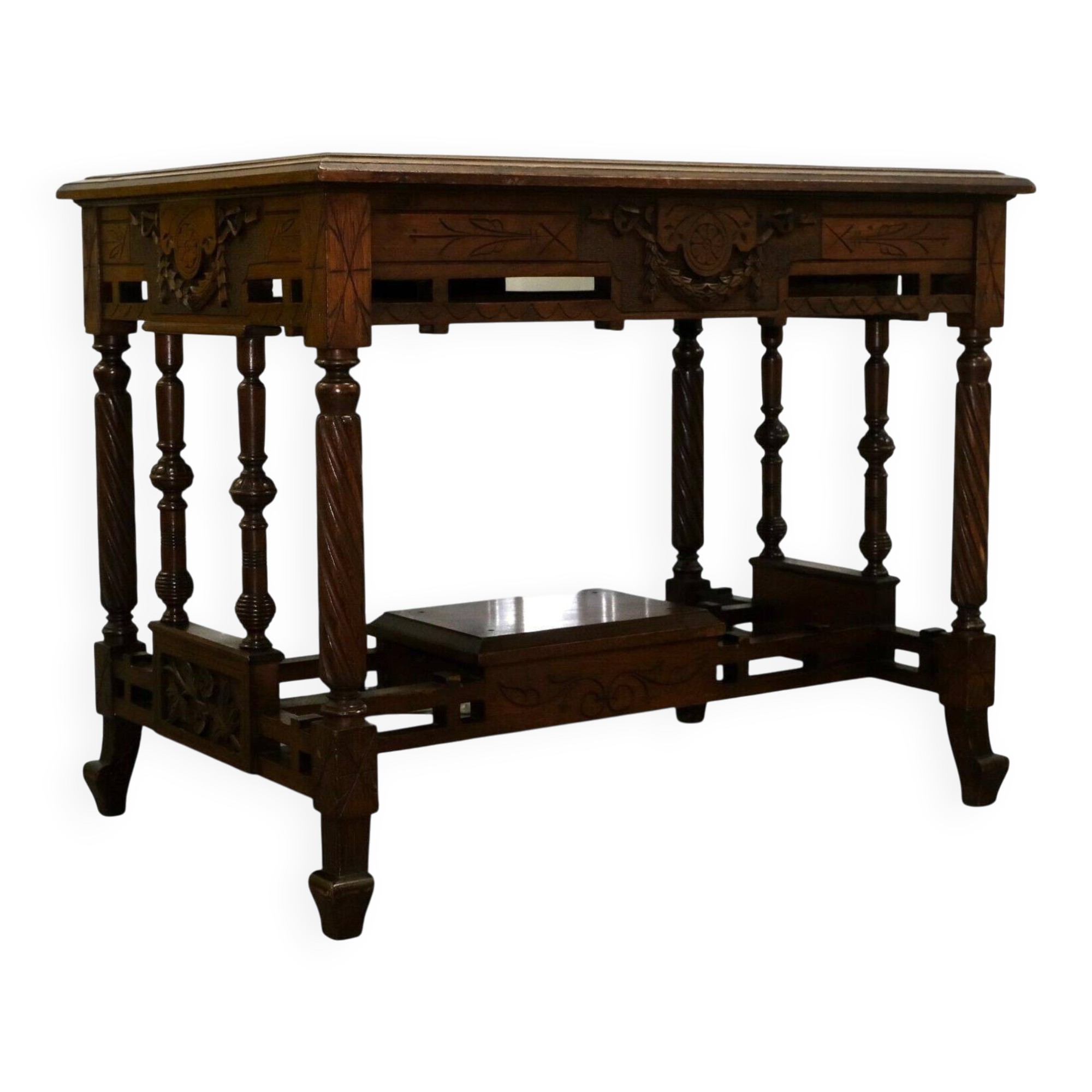 19th-century carved walnut desk with a leather top.