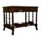 19th-century carved walnut desk with a leather top.