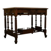 19th-century carved walnut desk with a leather top.